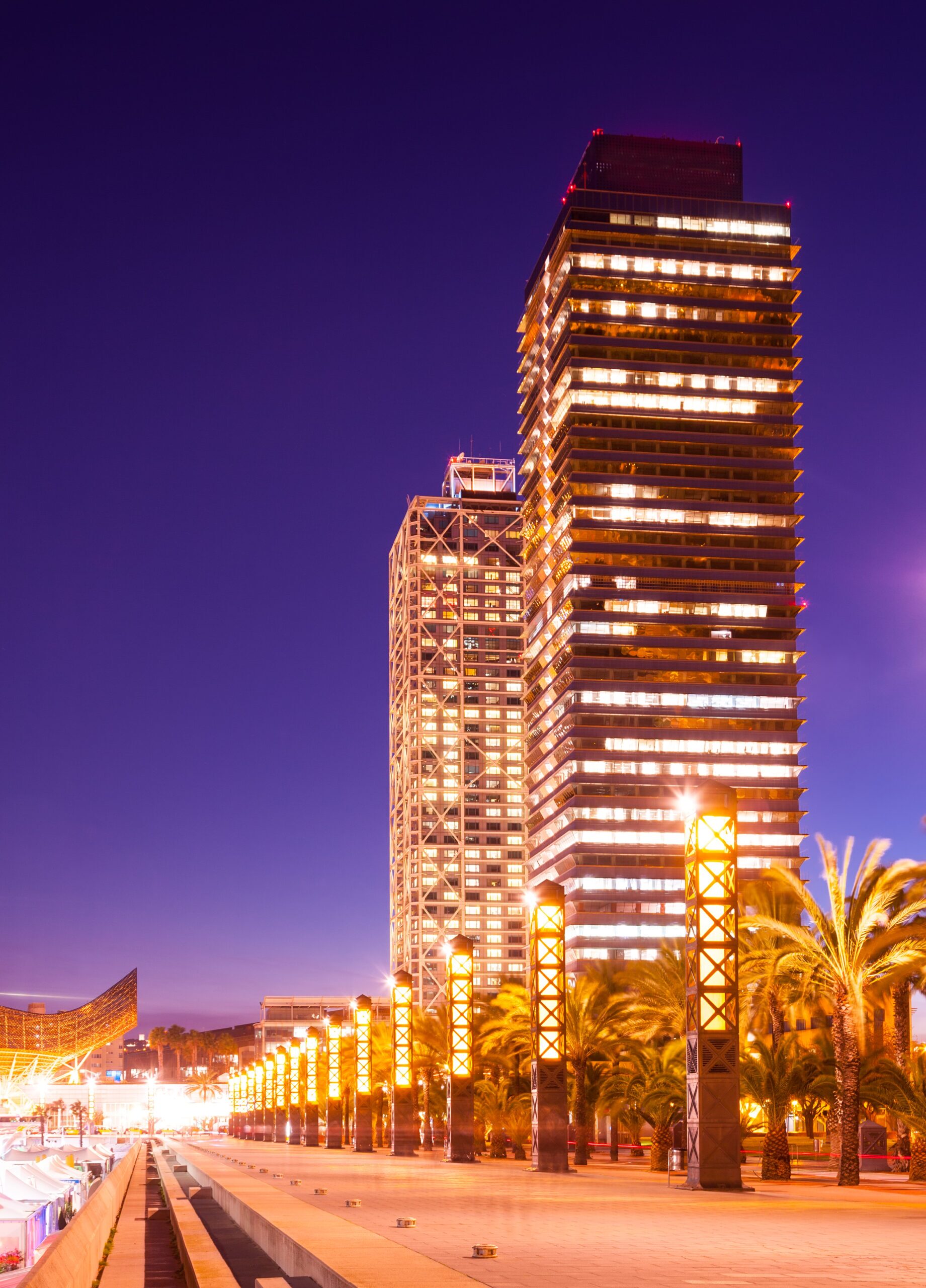 night view of skyscraper in Port Olimpic Urban city architecture